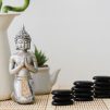 buddha-figure-front-bamboo-plant-volcanic-stones