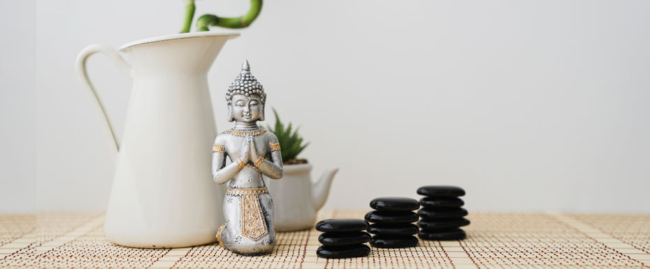 buddha-figure-front-bamboo-plant-volcanic-stones