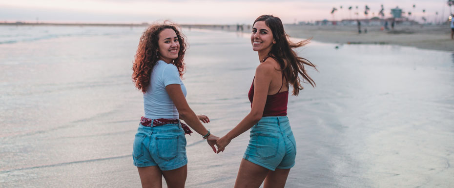 Two Girls Runing on the beach