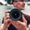 Man holding camera in the nature