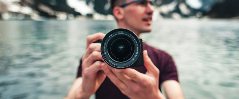 Man holding camera in the nature