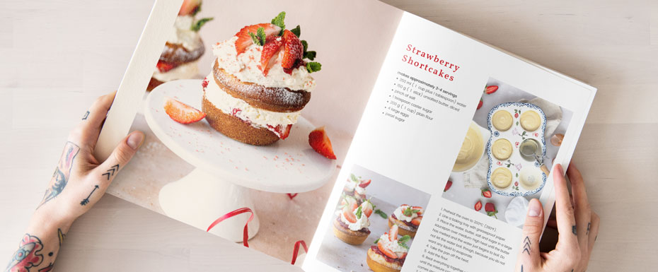 Woman holding cooking book in her hands in bright Set Up