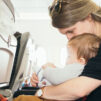 Woman holds baby in the airplane!