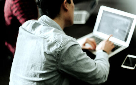 Man sitting in front of the computer