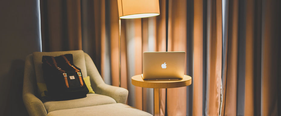 photo of Traveler Hotel Room and Laptop