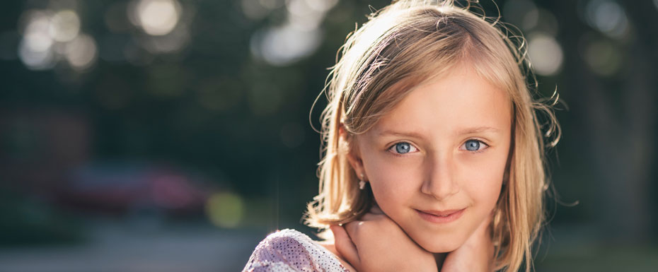 selective focus photography of girl in sequined-white and pink stripe shirt