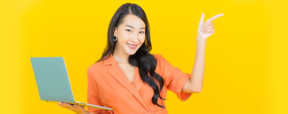 Portrait beautiful young asian-woman-smile with computer laptop yellow