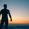 Silhouette photography standing on peak front of high rise buildings